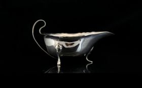 Silver Sauce Boat Of plain form with tripod feet, hallmark rubbed, total weight 147 grams.