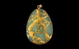 Large Pear Shaped Jadeite Stone Pendant Overlaid In 14ct Gold Depicting a pair of exotic birds