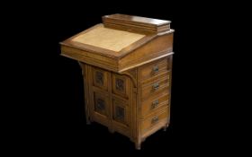 Early 20th Century Davenport Comprising carved rosette front panel with a bank of four drawers and