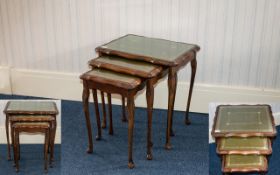 Nest Of Three Tables Of shaped rectangular form on cabriole legs with tooled leather tops.