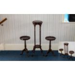 A Pair Of Modern Mahogany Finish Tripod Tables Each with moulded tops and barley twist supports.