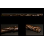 Indonesian Hardwood Carved Walking Stick The top carved in the form of a clenched hand,