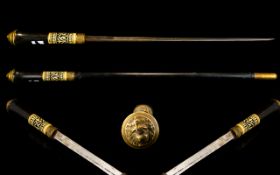 An Eastern Ebonised Sword Stick (Swagger Stick) The Carved Bone Handle With Lion Mask Terminus,