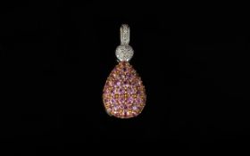 18ct White Gold Diamond Set Pendant Diamond set bale and ball above a pink gemstone pear shaped