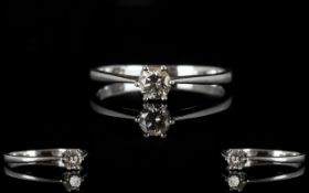 Platinum And Diamond Single Stone Ring Set with a round modern brilliant cut diamond,