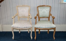 A Pair Of French Style Open Arm Chairs Each with moulded floral and foliate detail to back and