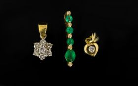 Three 18ct Gold Gemset Pendants Comprising emerald and diamond drop,