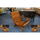 A Contemporary Teak Sleigh Chair Custom made chair of slatted form with scrolling arms and curved