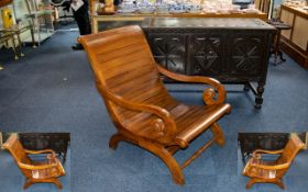 A Contemporary Teak Sleigh Chair Custom made chair of slatted form with scrolling arms and curved