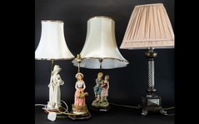 Three Contemporary Decorative Figural Lamps Two with shades, together with one other column lamp,