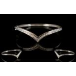 A 9ct White Gold Hinged Bangle Wishbone