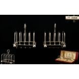 A Fine Pair of Presentation Boxed Sterling Silver Toast-racks of Small Proportions,