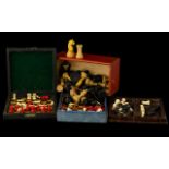 A Collection Of Four Early 20th Century Travelling Chess Sets To include turned bone/cellulose