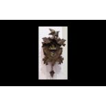 A German Black Forest Cuckoo Clock Of traditional form,