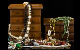 A Large Quantity Of Costume Jewellery Items A varied lot to include two miniature wooden jewellery