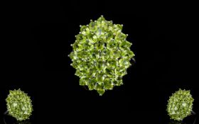 Peridot Large Oval Cluster Ring, a large cluster of oval and round cuts of peridot totalling 6.