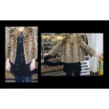 1960's Ocelot Jacket Hip length jacket with side seam pockets, revere collar and oversized faux