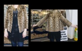 1960's Ocelot Jacket Hip length jacket with side seam pockets, revere collar and oversized faux