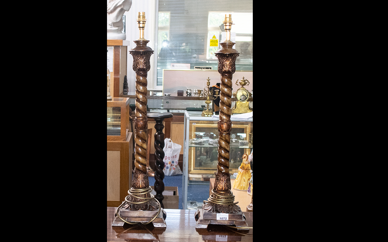 A Pair Of Reproduction Table Lamp Bases each raised on square base with barley twist column and