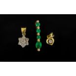 Three 18ct Gold Gemset Pendants Comprising emerald and diamond drop, diamond flower and heart form