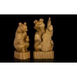 A Pair Of Novelty Carved Bear Figures The first seated with open mouth,