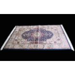 A Large Woven Silk Carpet Keshan rug with blue ground and traditional Middle Eastern floral and