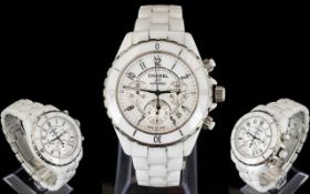 Chanel Ceramic J12 Wristwatch chronograph watch with white bezel and iconic white ceramic strap.