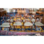 A Set of Eight Balloon Back Dining Chairs comprising two carvers and six dining chairs,