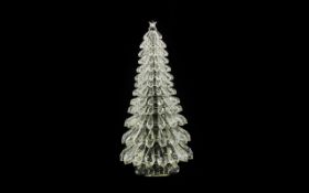 A Lead Crystal Christmas Tree Centrepiece Large faceted glass model with cut crystal star to top,