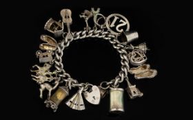 A Silver Curb Bracelet Loaded with 20 Solid Silver Old Charms, All Marked for Silver,