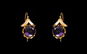 Antique 14ct Gold And Amethyst Earrings Wired drop earrings each set with a large faceted amethyst,