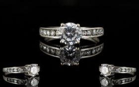 A 9ct White Gold And CZ Set Solitaire Ring Marked 9ct to shank and set with central faceted CZ,