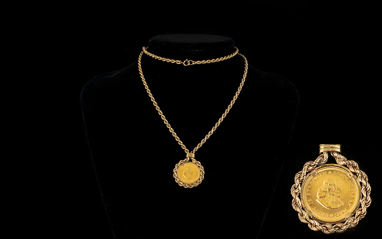 South African 22ct Gold One Rand Coin Dated 1967, within a 9ct Gold Rope Mount and Chain.