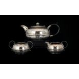 Arts And Crafts Three Piece Plated Planished Tea Set Of Squat form, comprising teapot,