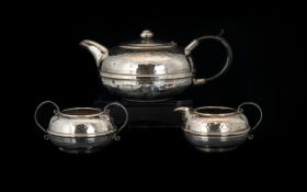 Arts And Crafts Three Piece Plated Planished Tea Set Of Squat form, comprising teapot,