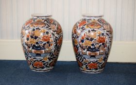 A Pair of Large Oriental Style Vases - each of ovoid form, decorated with traditional, floral,