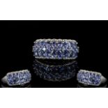 Tanzanite Three Row Band Ring, comprising two rows of pear cut tanzanites, closely set,