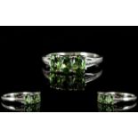 Green Apatite Three Stone Ring, three oval cut natural green apatites, totalling 1.