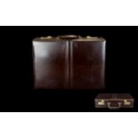 Leather Briefcase Of typical form with gold hardware and combination lock,