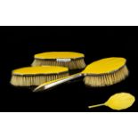Three Silver And Guilloche Enamel Brushes Comprising hairbrush and two clothes brushes,