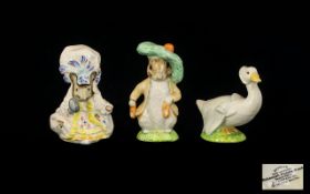 Beswick A Collection Of Beatrix Potter Figures Three in total to include 'Lady Mouse' height 4 1/2