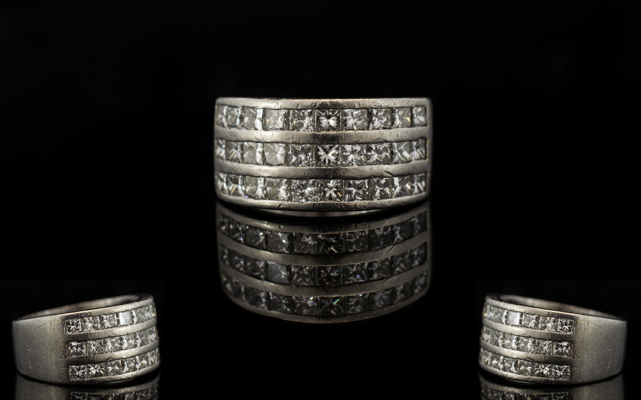 Platinum And Diamond Set Superb And Attractive Contemporary Ring Comprising three rows of ten