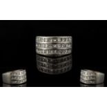 Platinum And Diamond Set Superb And Attractive Contemporary Ring Comprising three rows of ten