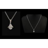 A Stunning And Contemporary Sterling Silver And Faceted CZ Set Pendant Necklace Comprising Fine