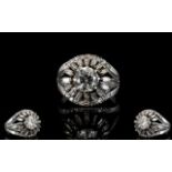 18ct White Gold And Diamond Cluster Ring Set with a central round brilliant cut diamond of approx 1.