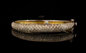 A Contemporary Silver And Crystal Set Bangle Elegant bangle of shaped form,