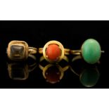 A Collection Of Three Gold And Stone Set Dress Rings Each of plain form, one set with coral,