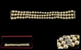 A Triple Strand Pearl Bracelet Comprising very well matched 7-8mm pearls,