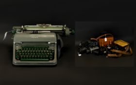 An Olympia Typewriter Together With A Quantity Of Super 8 And 35 mm Cameras 1960's typewriter,