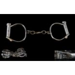 Set Of Four Victorian Shackles / Handcuffs Of Typical Form. Overall Length 9.5 Inches.